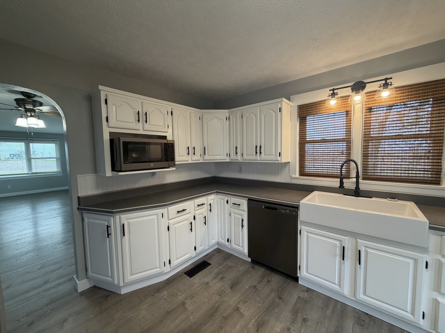 15266 LeRoy Road Farmer City, IL 61842 - Photo 5 of 36 a kitchen with granite countertop white cabinets and sink