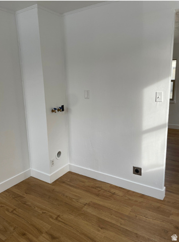 230 North 2nd Street Tooele, UT 84074 - Photo 7 of 18 Dedicated laundry area featuring wood-finish flooring, white walls, and bright white baseboards