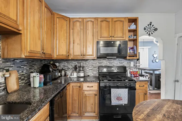 a view of a dining room with furniture and window