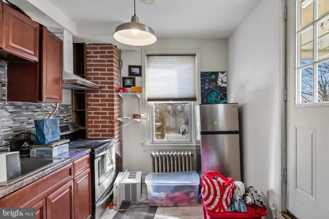a bed room with a bed and a chandelier