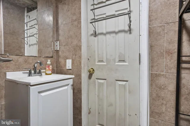 a view of storage and utility room with racks on the wall
