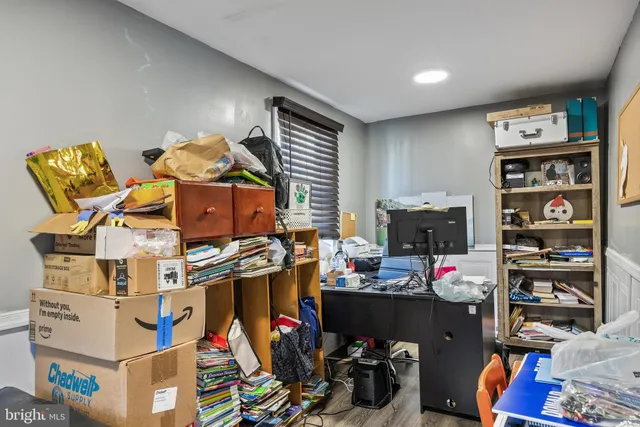 a living room with fireplace furniture and a flat screen tv