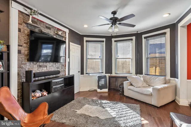 a white toilet sitting next to a bathroom sink and vanity