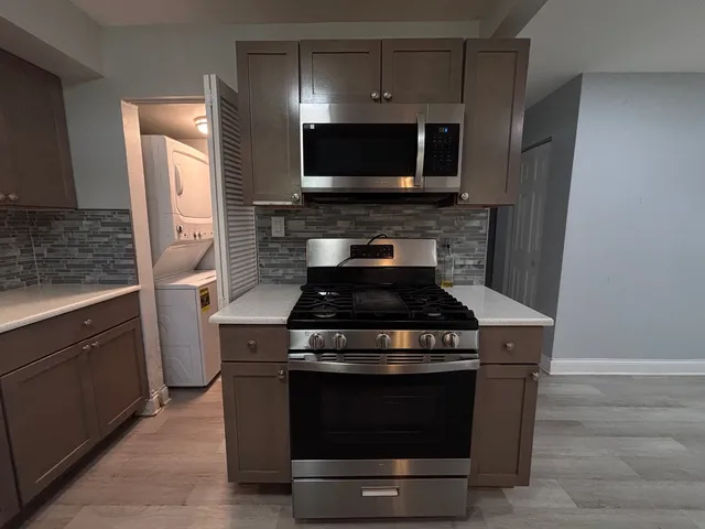 a kitchen with a stove and a microwave