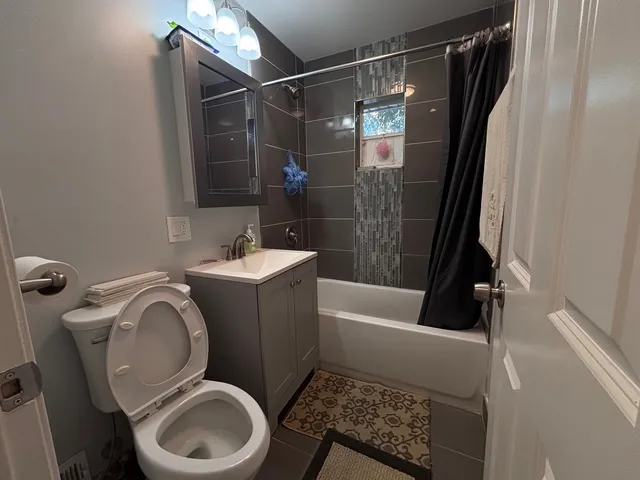 a bathroom with a toilet and a sink