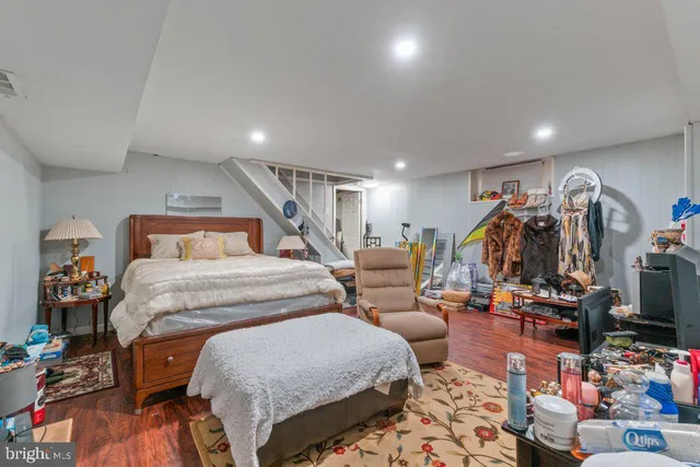 a bedroom with furniture and a gym equipment