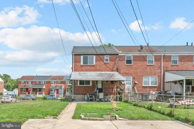 a swimming pool with outdoor seating and yard