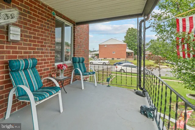 a view of a chairs and table in the balcony