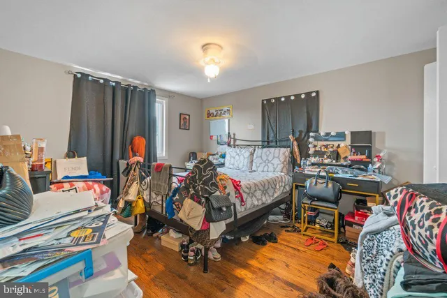 a bed room with furniture and a flat screen tv