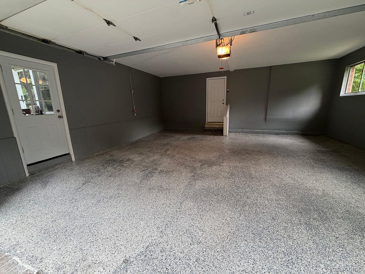 3520 Rayburn Road Bloomfield Hills, MI 48304 - Photo 11 of 26 Epoxy-finished concrete flooring, white interior door with glass panes, white interior door, and a built-in window