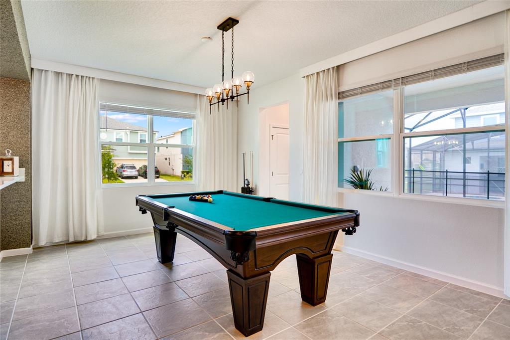 2341 Salty Winds Way Kissimmee, FL 34747 - Photo 16 of 79 a room with pool table and windows