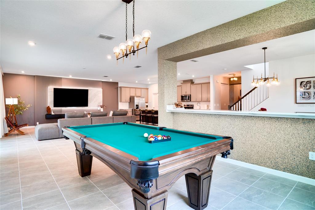 2341 Salty Winds Way Kissimmee, FL 34747 - Photo 18 of 79 a room with pool table and flat screen tv
