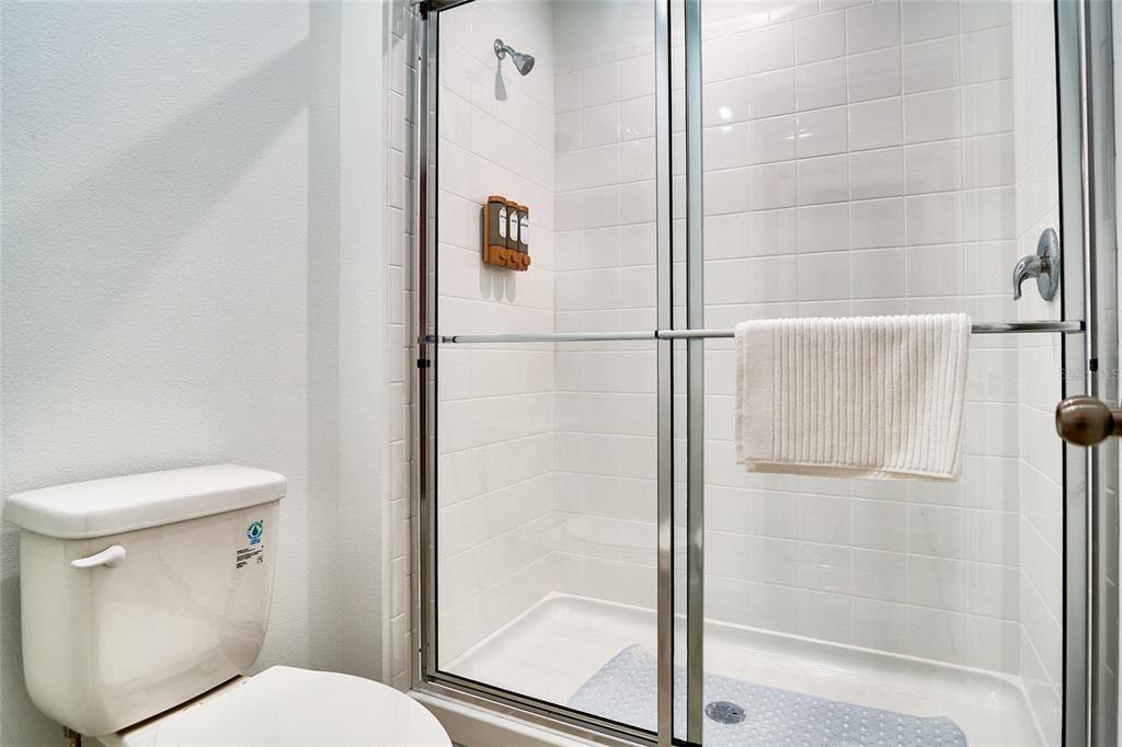 2341 Salty Winds Way Kissimmee, FL 34747 - Photo 45 of 79 a bathroom with a toilet and a shower