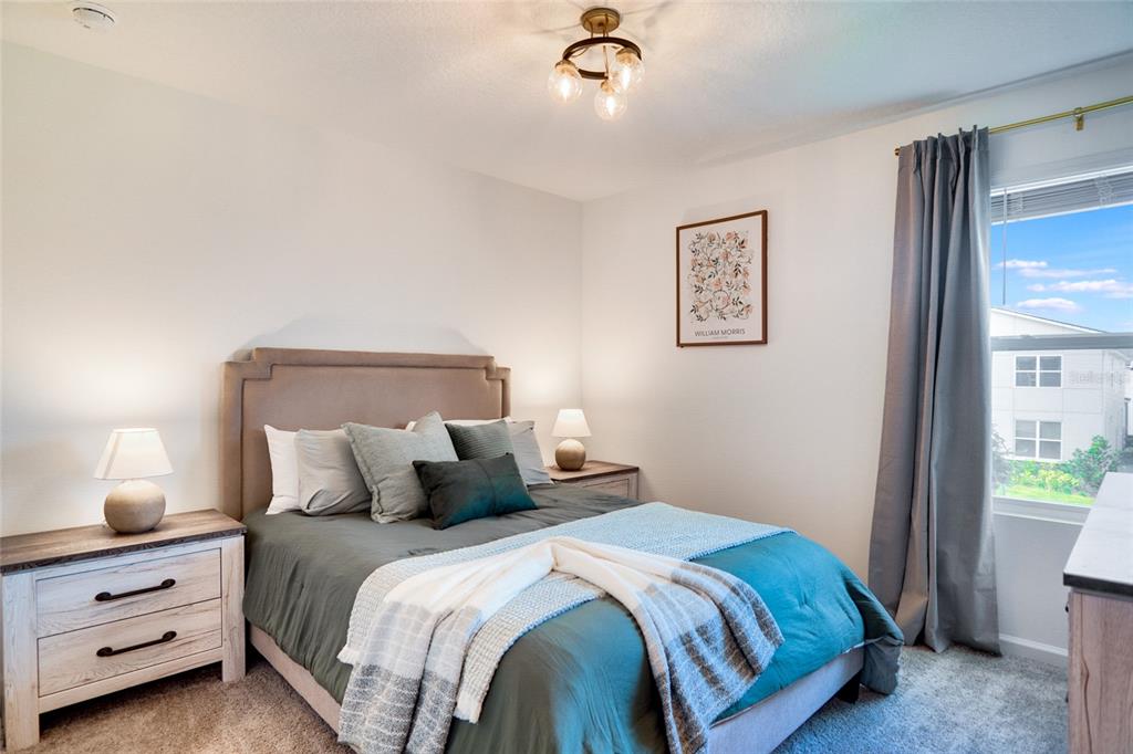 2341 Salty Winds Way Kissimmee, FL 34747 - Photo 47 of 79 a bedroom with a bed and a window