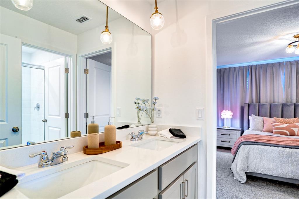 2341 Salty Winds Way Kissimmee, FL 34747 - Photo 67 of 79 a bedroom with a bed and a sink