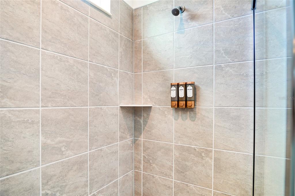 2341 Salty Winds Way Kissimmee, FL 34747 - Photo 7 of 79 a bathroom with a shower