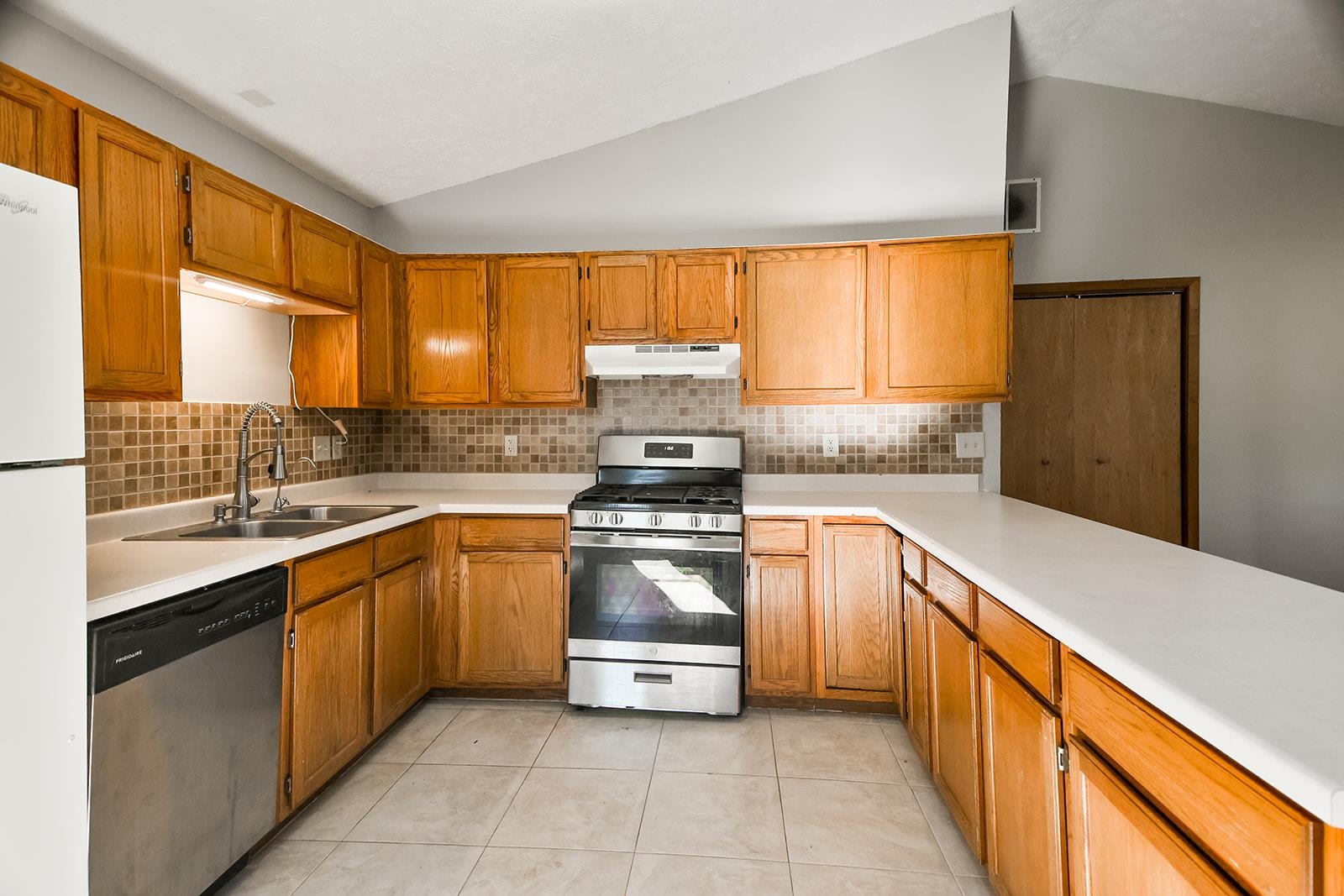 515 Pembroke Road Southwest Poplar Grove, IL 61065 - Photo 11 of 24 a kitchen with stainless steel appliances granite countertop a sink and a stove
