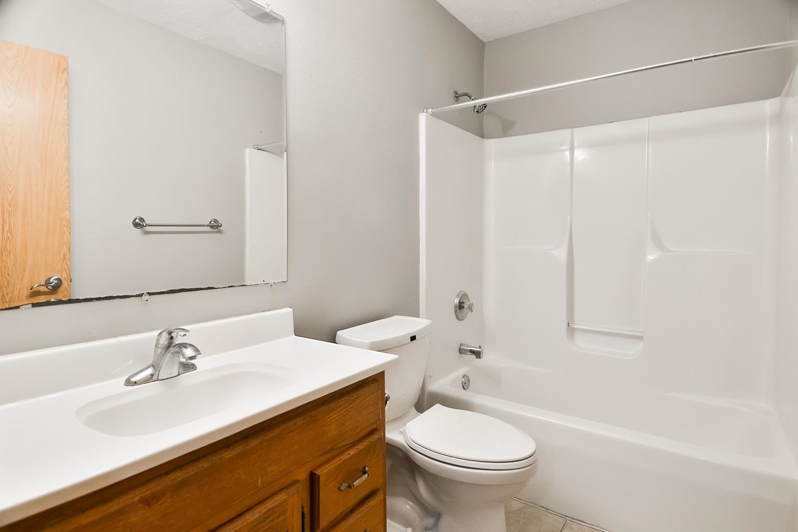515 Pembroke Road Southwest Poplar Grove, IL 61065 - Photo 16 of 24 a bathroom with a sink a toilet and a bathtub