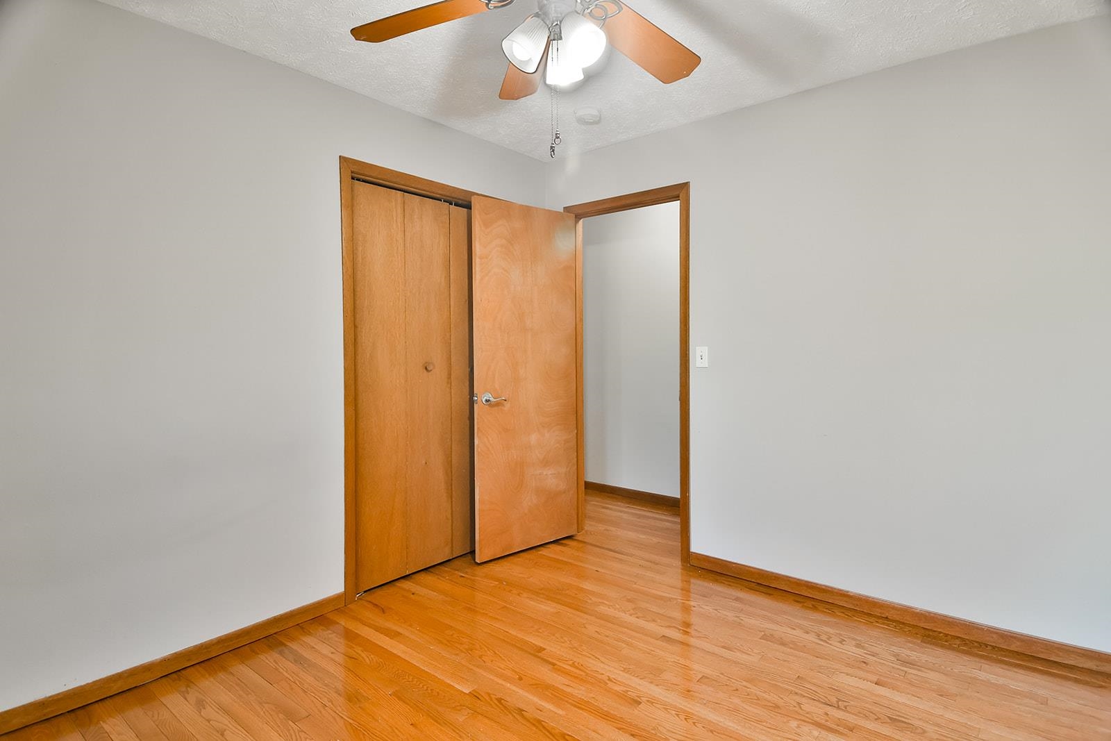 515 Pembroke Road Southwest Poplar Grove, IL 61065 - Photo 17 of 24 a view of an empty room with wooden floor and a window