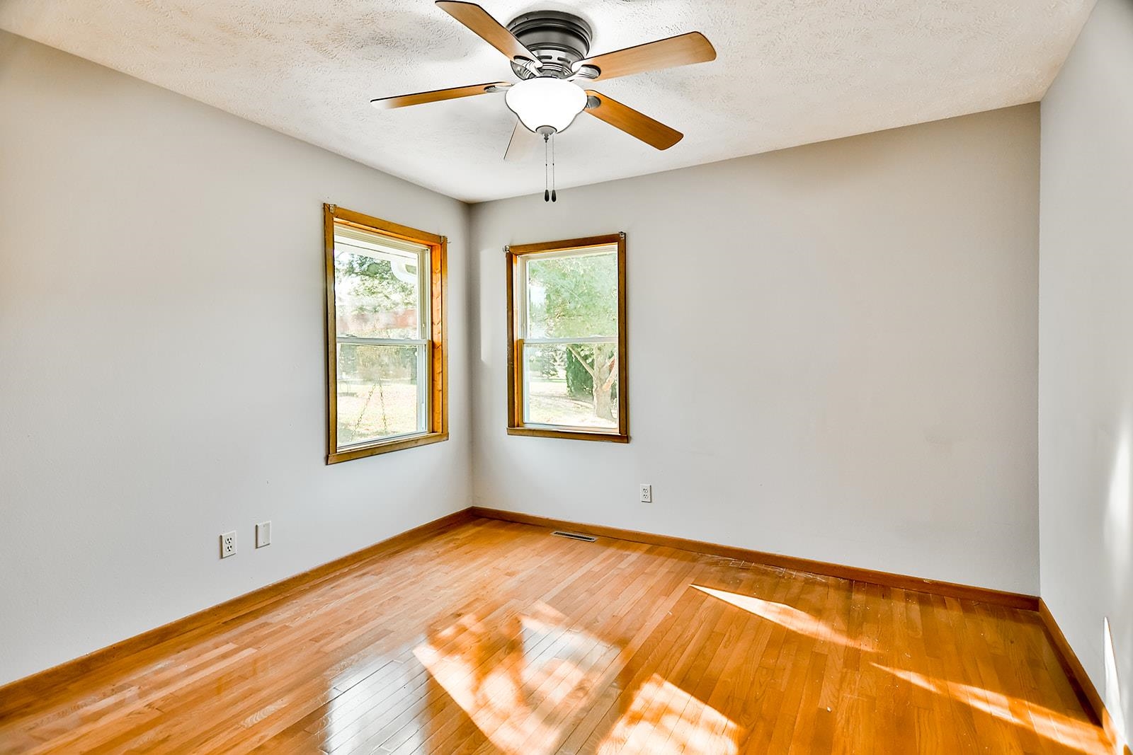 515 Pembroke Road Southwest Poplar Grove, IL 61065 - Photo 22 of 24 a view of an empty room with window and chandelier fan