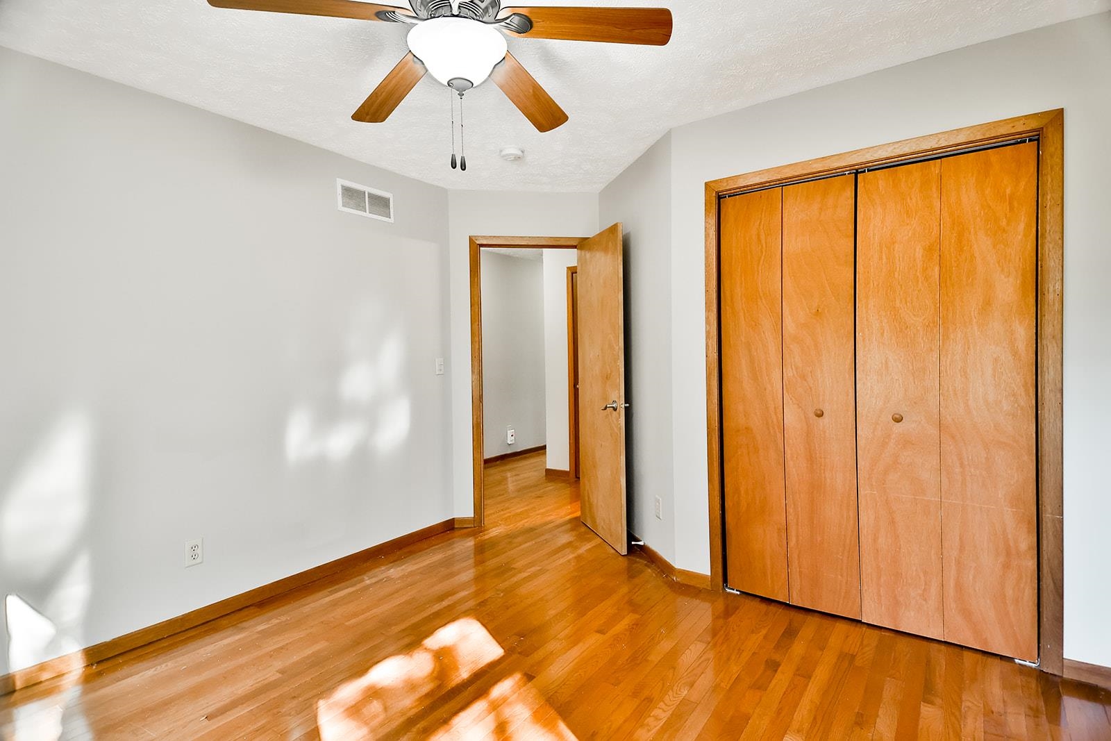 515 Pembroke Road Southwest Poplar Grove, IL 61065 - Photo 24 of 24 a view of an empty room with wooden floor and a window