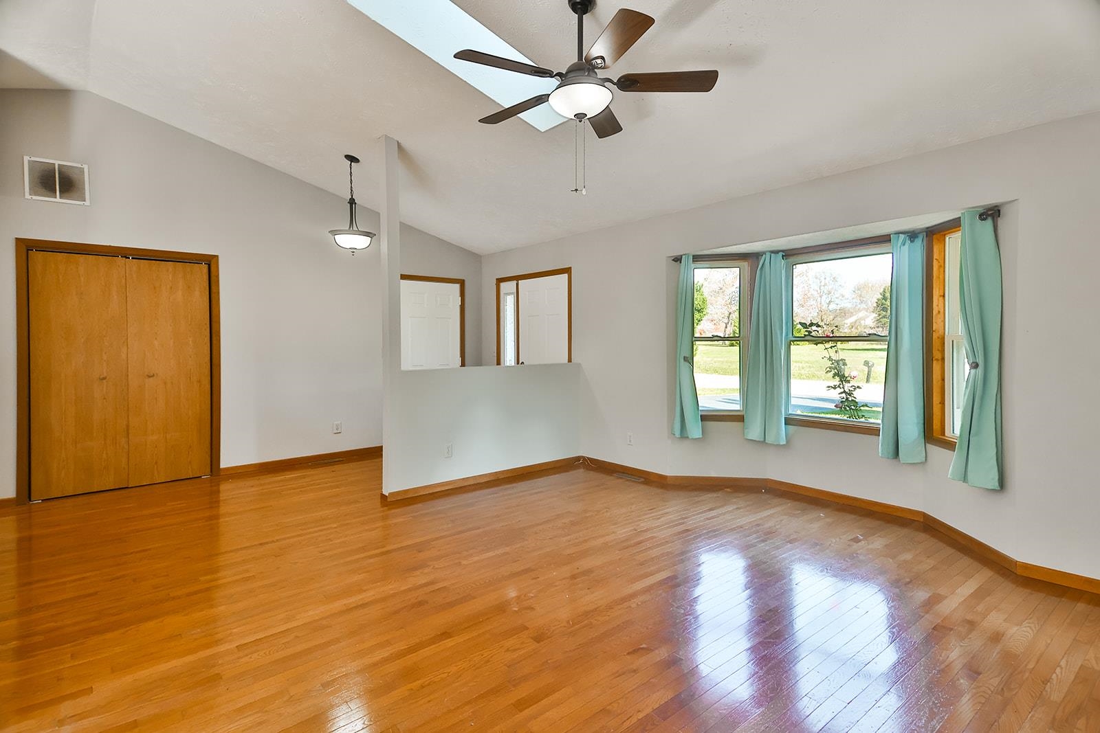 515 Pembroke Road Southwest Poplar Grove, IL 61065 - Photo 4 of 24 a view of an empty room with window and wooden floor