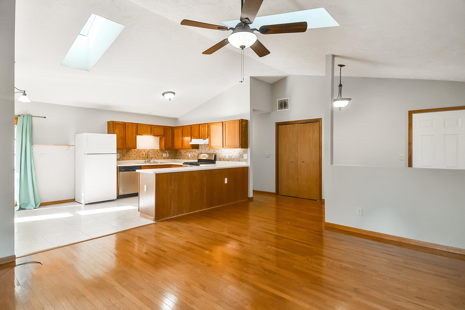 515 Pembroke Road Southwest Poplar Grove, IL 61065 - Photo 8 of 24 a view of a kitchen with a sink a refrigerator and a stove top oven