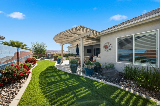2829 East 1880th Street South St. George, UT 84790 - Photo 42 of 54 Fenced backyard featuring a pergola and a patio area