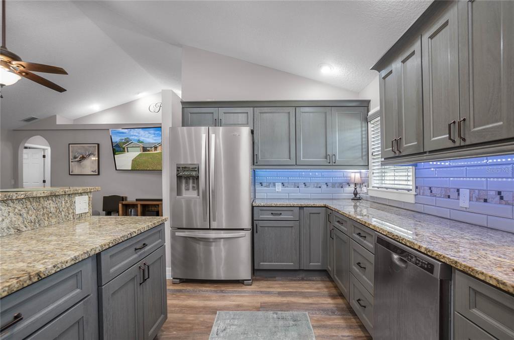 5466 West Tortuga Loop Lecanto, FL 34461 - Photo 13 of 41 a kitchen with stainless steel appliances granite countertop a sink stove and refrigerator