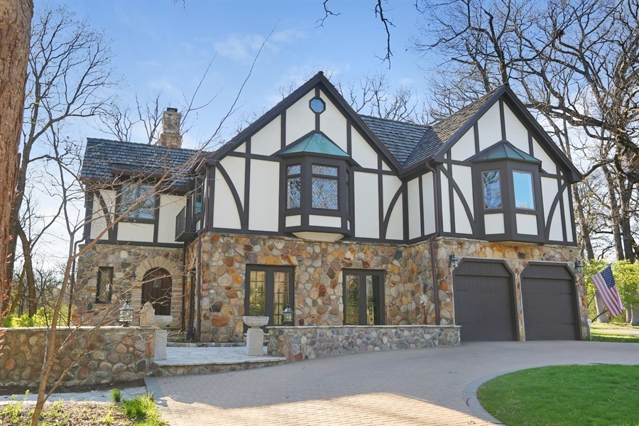 8100 South County Line Road Burr Ridge, IL 60527 - Photo 1 of 33 a front view of a house with garden