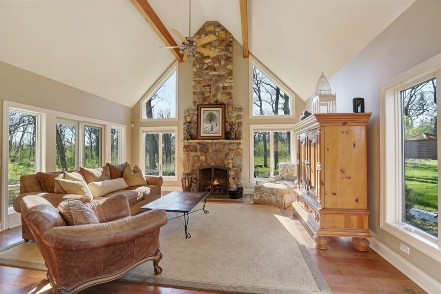 8100 South County Line Road Burr Ridge, IL 60527 - Photo 11 of 33 a living room with furniture large window and fireplace