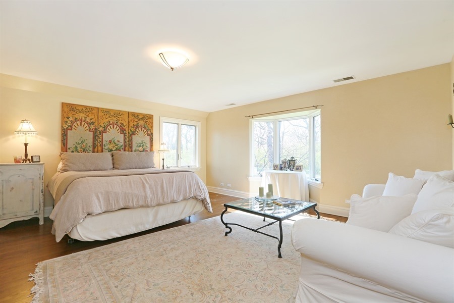 8100 South County Line Road Burr Ridge, IL 60527 - Photo 14 of 33 a bedroom with a bed and a couch