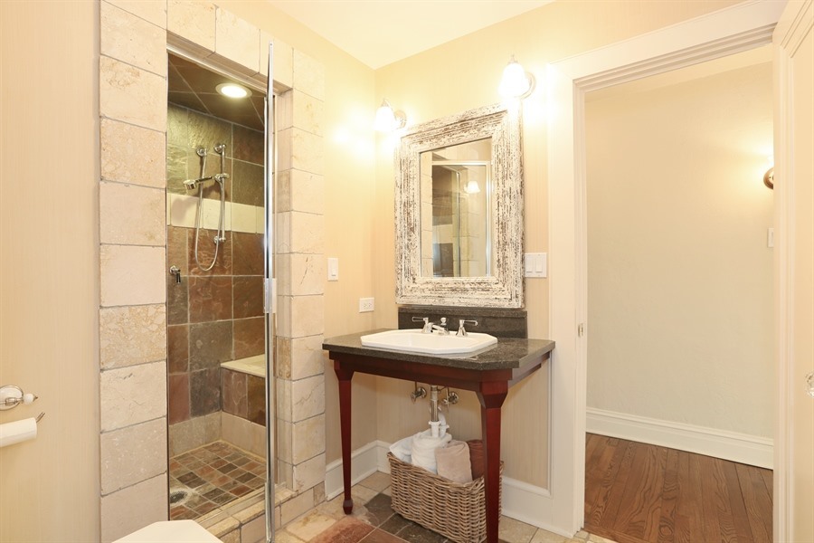 8100 South County Line Road Burr Ridge, IL 60527 - Photo 18 of 33 a bathroom with a sink and a mirror