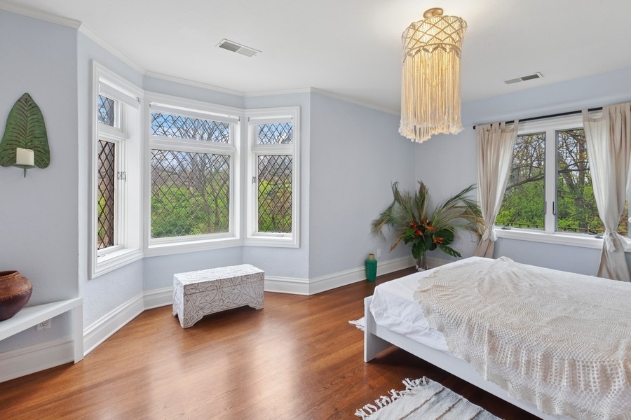 8100 South County Line Road Burr Ridge, IL 60527 - Photo 19 of 33 a bedroom with a bed and a window