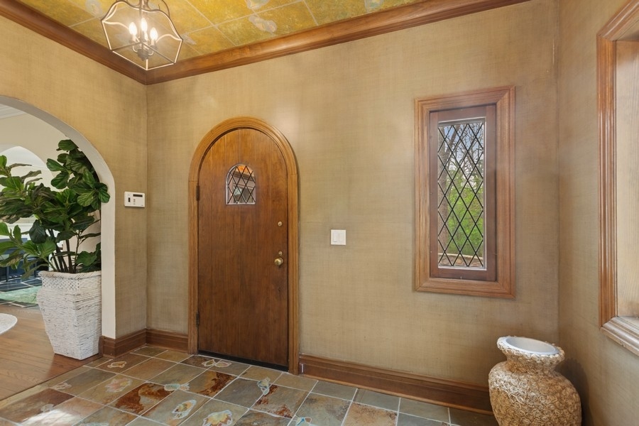 8100 South County Line Road Burr Ridge, IL 60527 - Photo 2 of 33 a view of a door and chair in a room