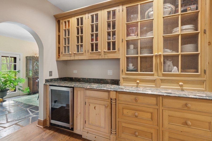 8100 South County Line Road Burr Ridge, IL 60527 - Photo 5 of 33 a kitchen with granite countertop a sink and cabinets