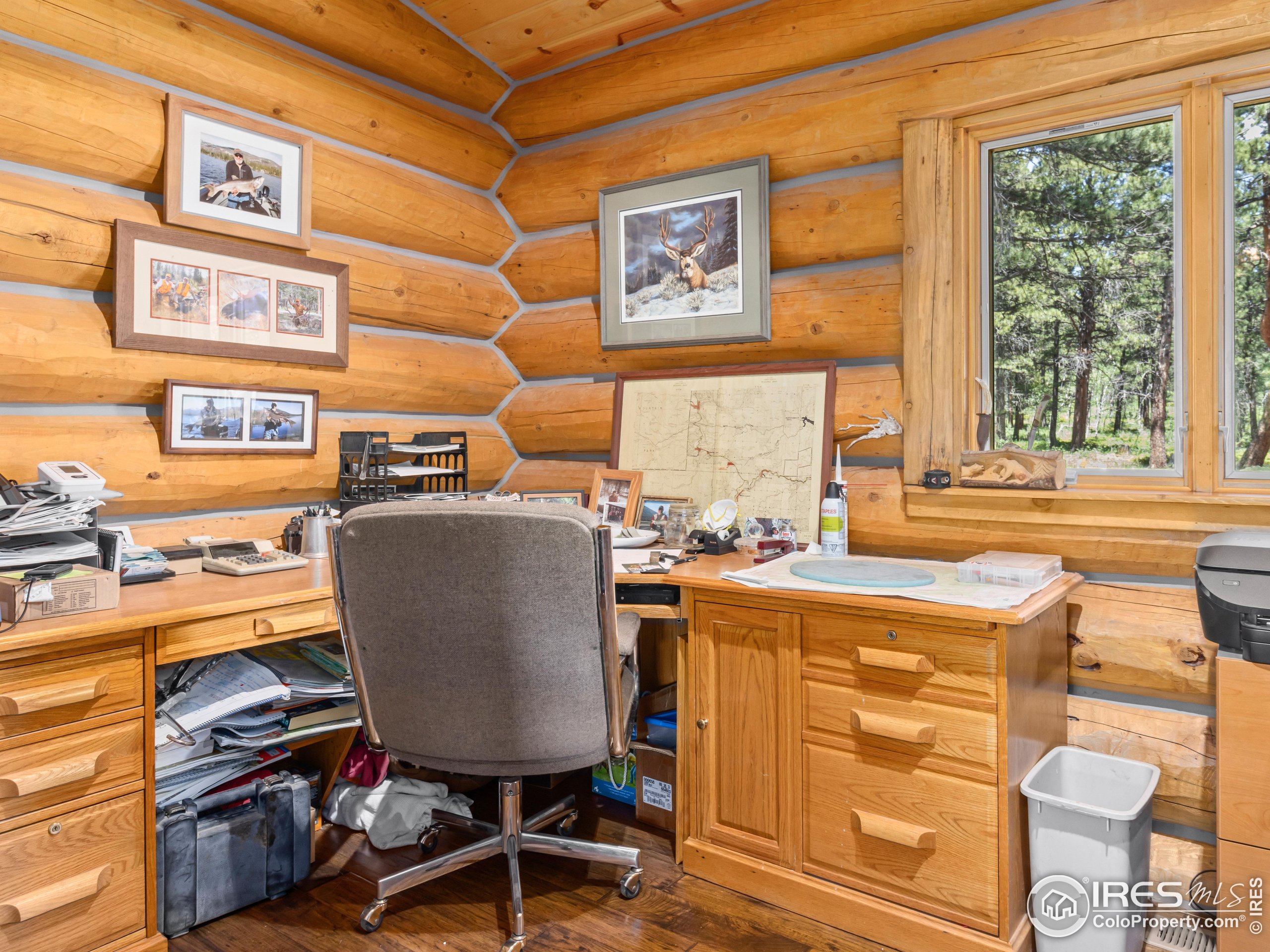 470 Big John Road Lyons, CO 80540 - Photo 19 of 38 a view of a workspace with furniture and a window