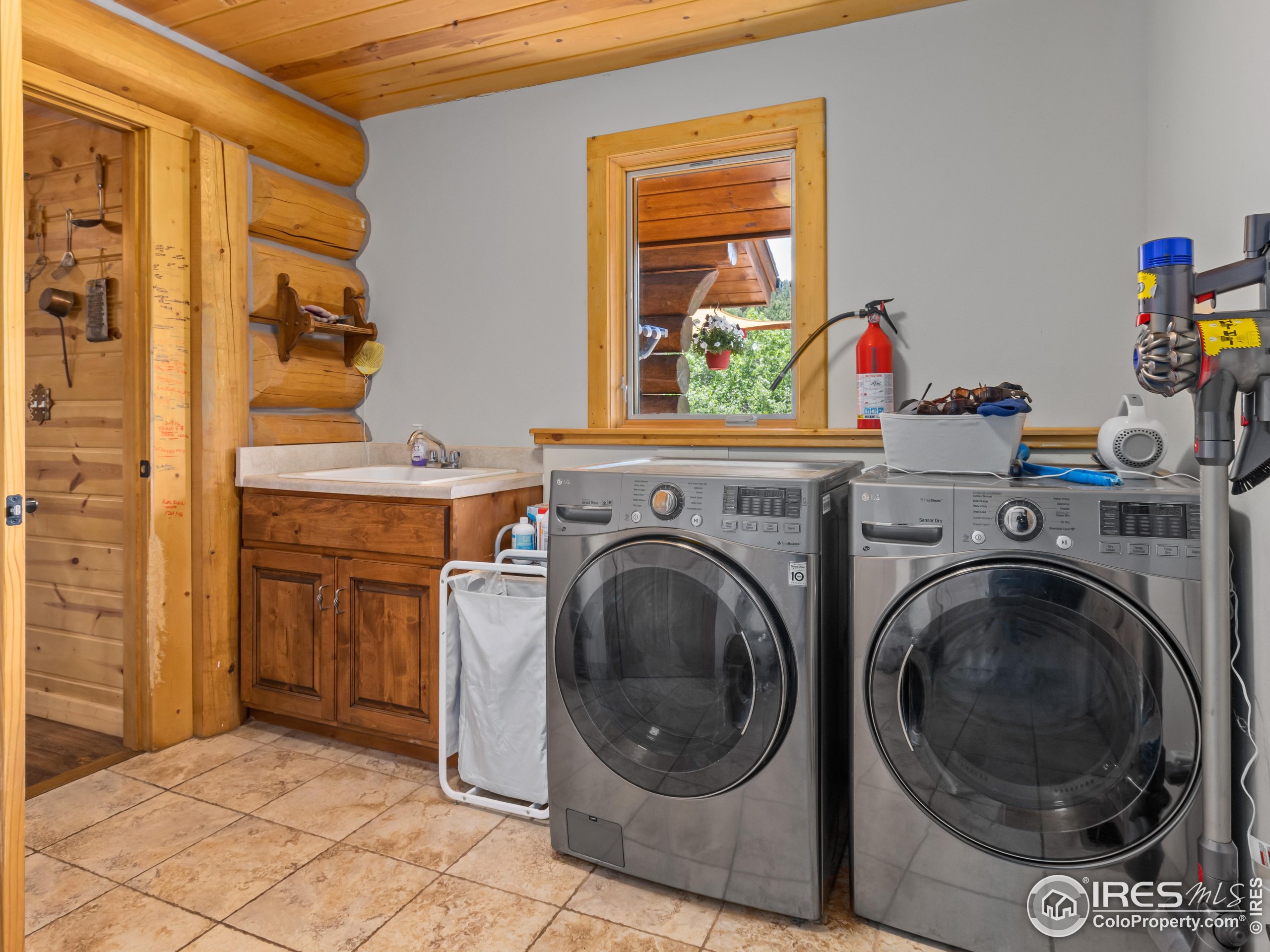 470 Big John Road Lyons, CO 80540 - Photo 21 of 38 a view of a storage & utility room with washer and dryer