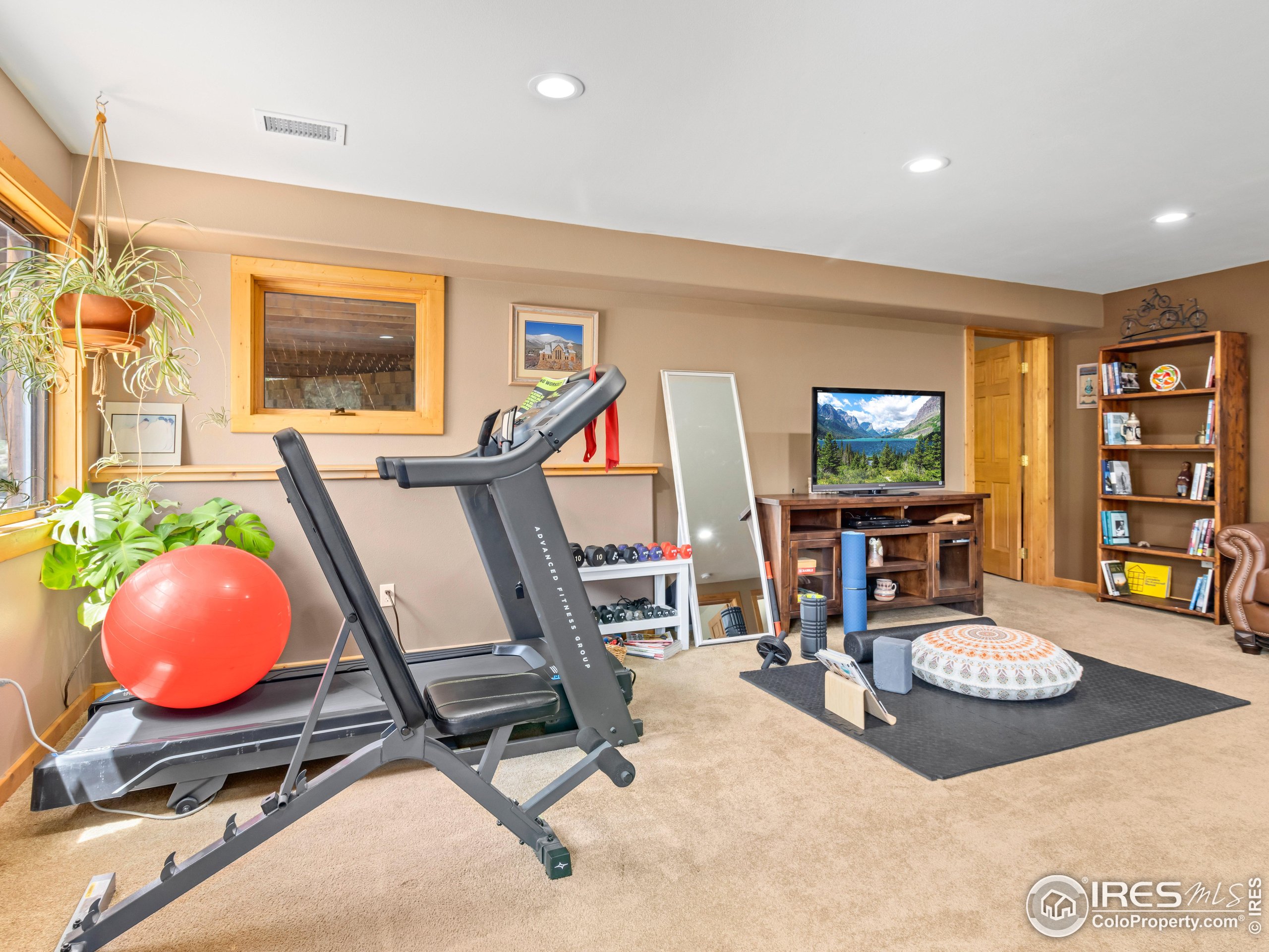 470 Big John Road Lyons, CO 80540 - Photo 26 of 38 a view of a workspace with furniture and a window