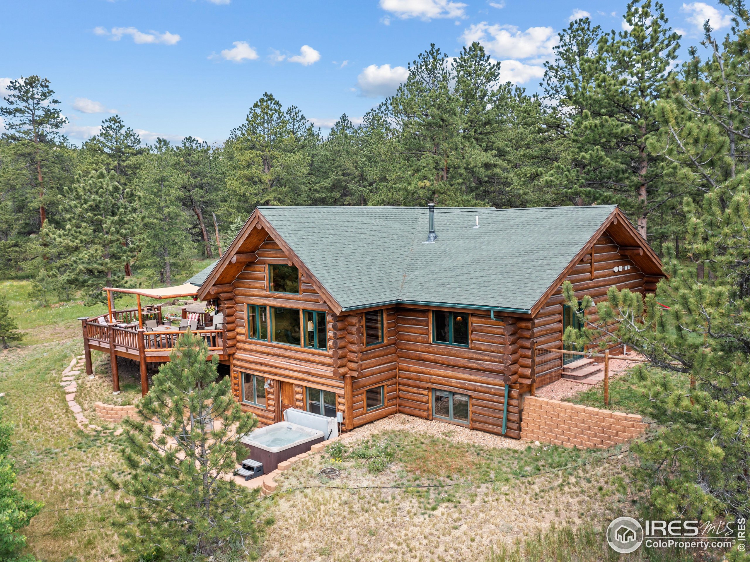 470 Big John Road Lyons, CO 80540 - Photo 30 of 38 a aerial view of a house with roof deck front of house
