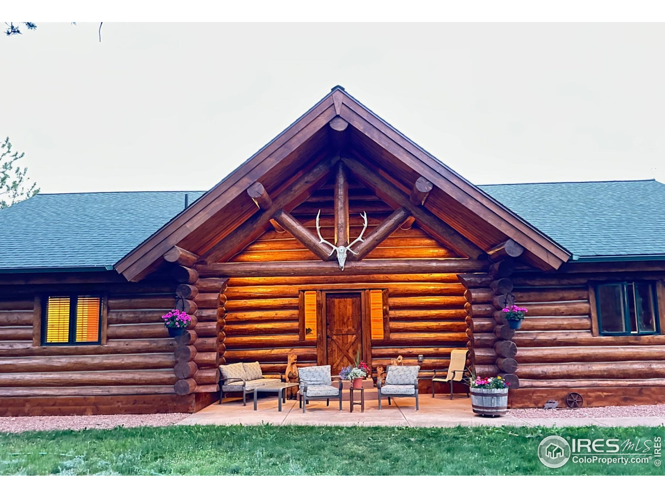 470 Big John Road Lyons, CO 80540 - Photo 3 of 38 a front view of a house with a yard