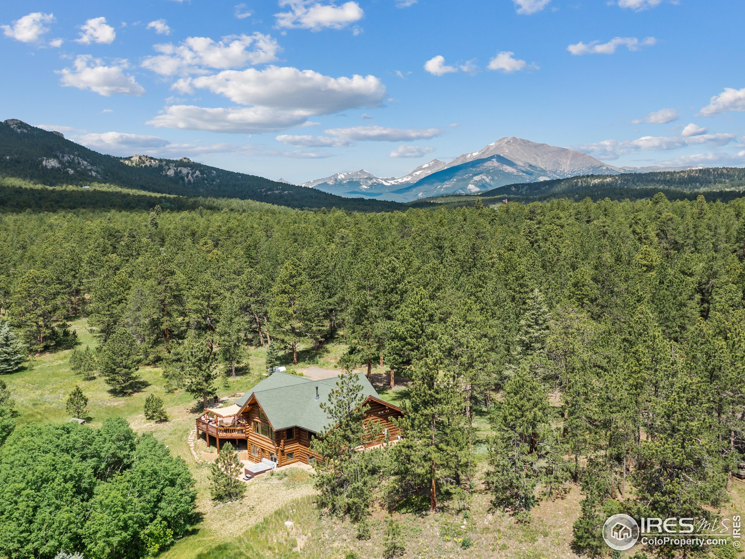 470 Big John Road Lyons, CO 80540 - Photo 36 of 38 a view of a lake with a mountain in the background