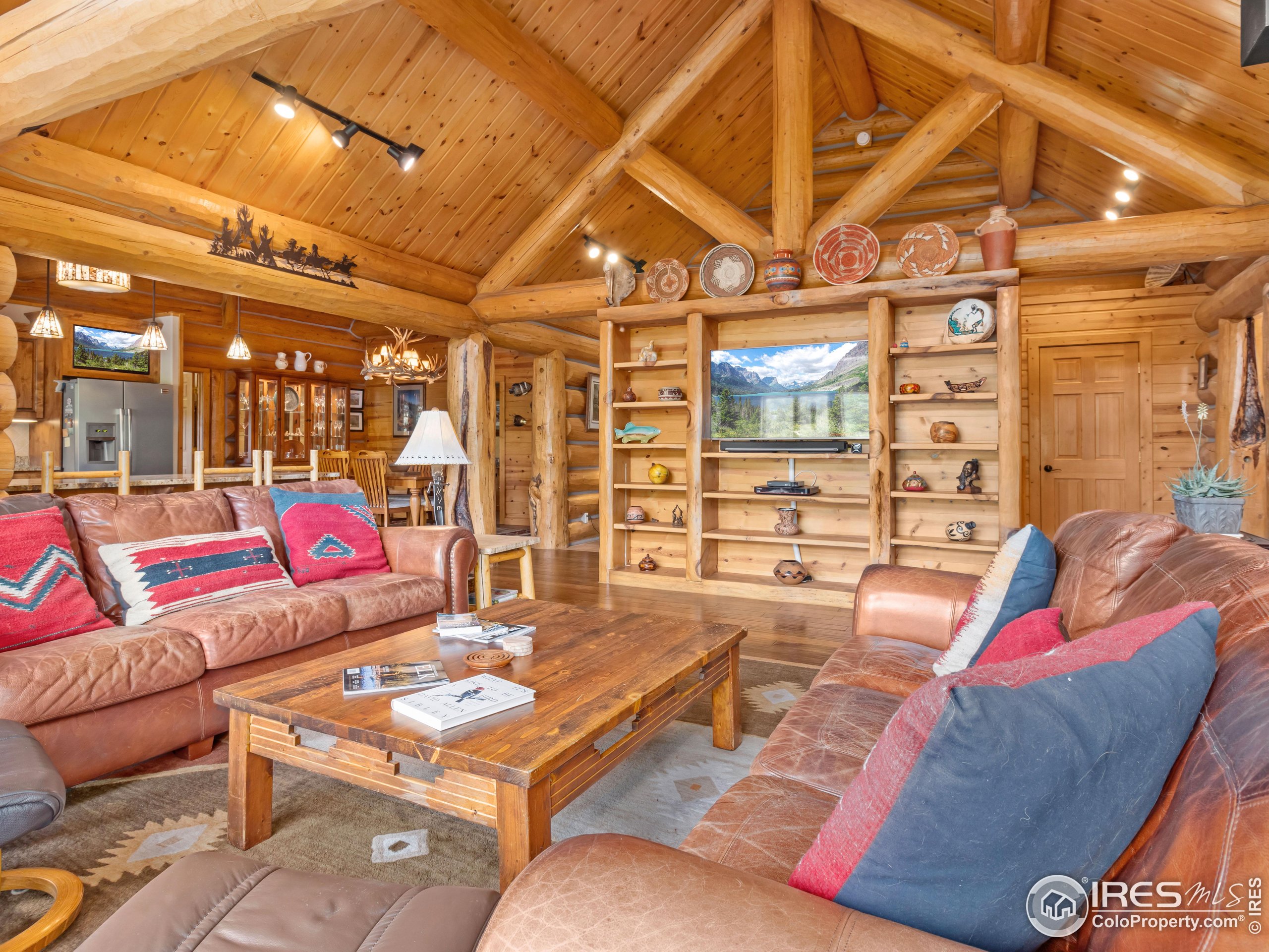 470 Big John Road Lyons, CO 80540 - Photo 9 of 38 a living room with furniture and wooden floor