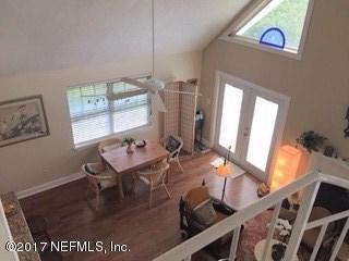 64 Manresa Road St. Augustine, FL 32084 - Photo 11 of 31 a view of a dining room with furniture window and wooden floor