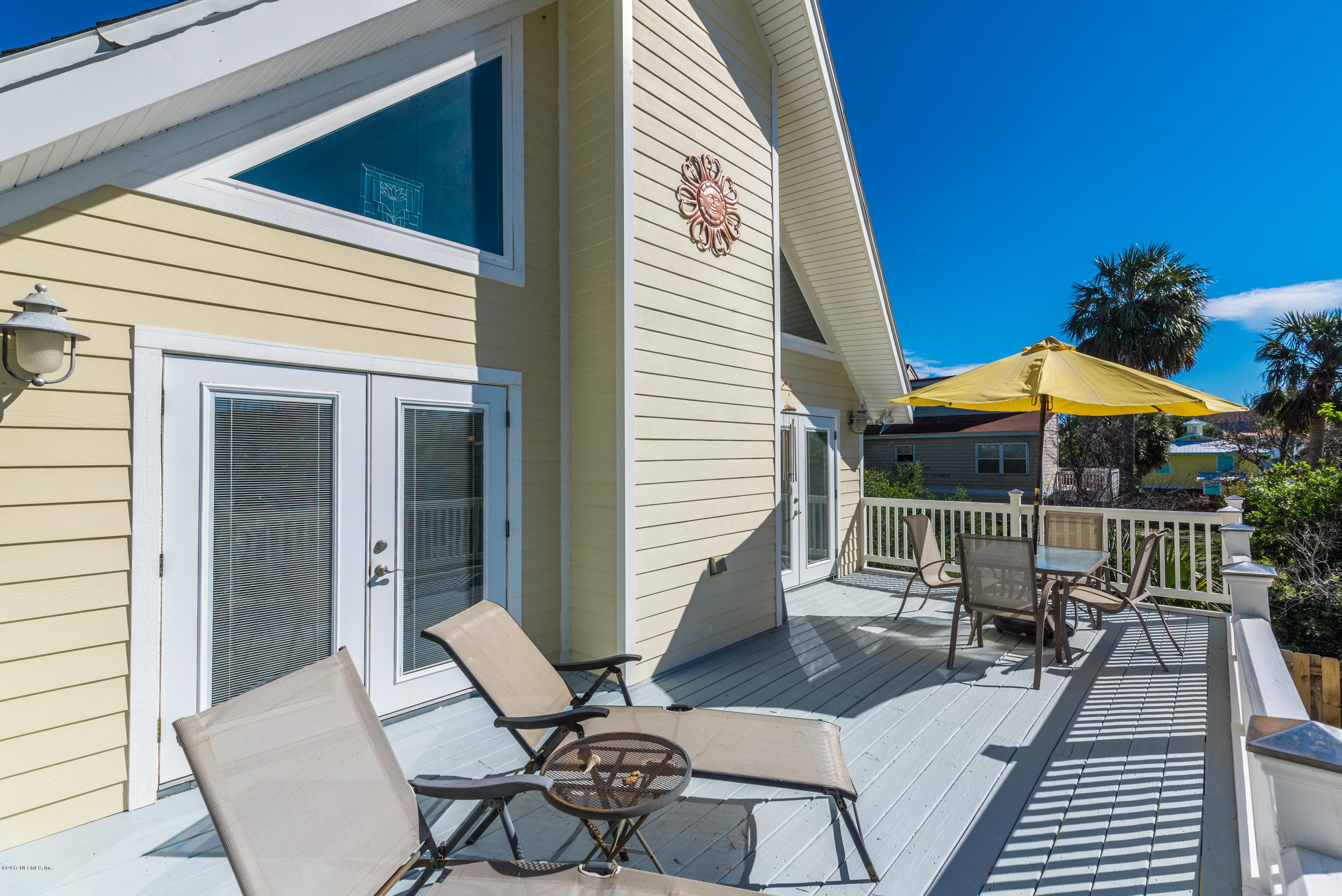 64 Manresa Road St. Augustine, FL 32084 - Photo 16 of 31 a patio with a table and chairs