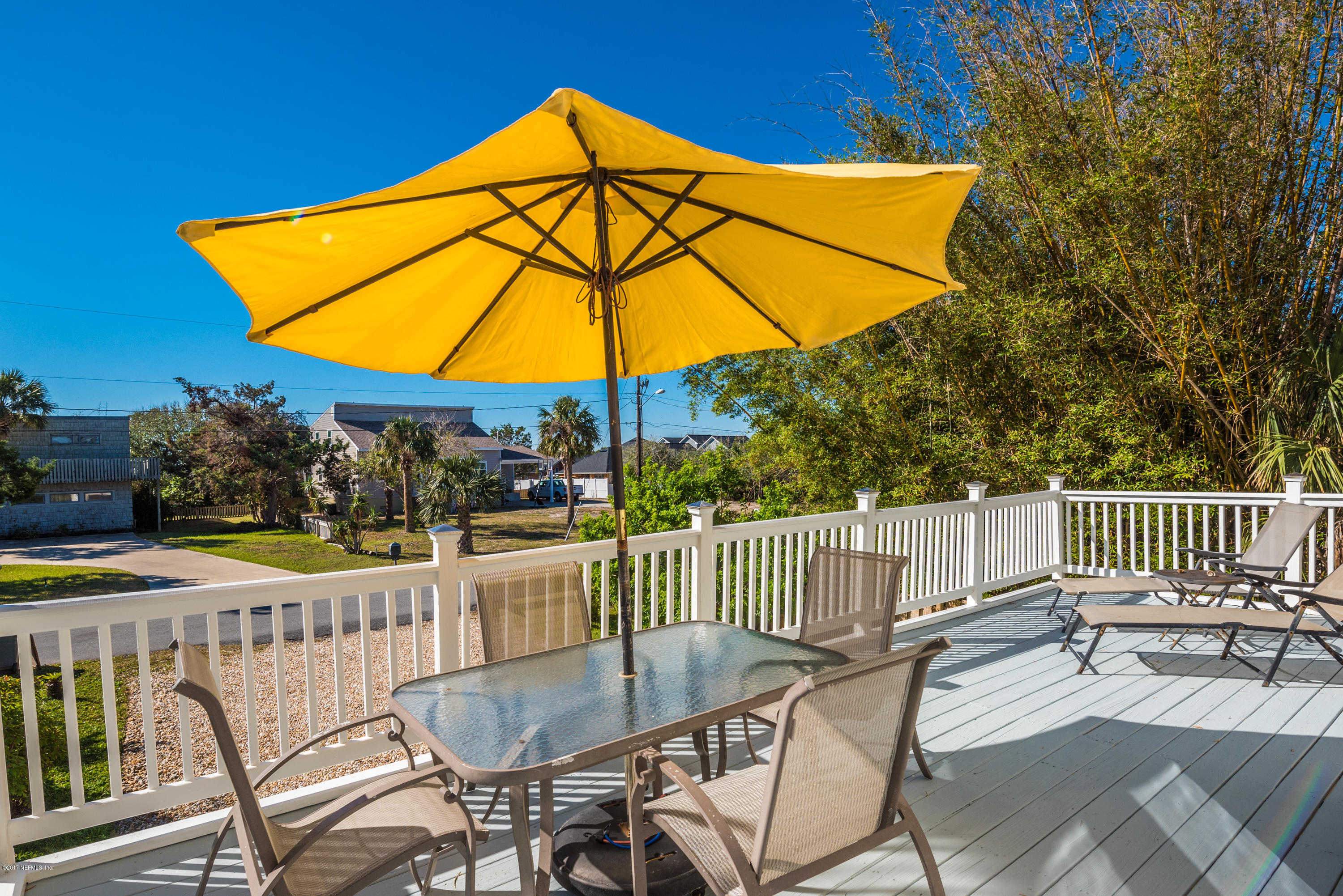 64 Manresa Road St. Augustine, FL 32084 - Photo 17 of 31 a view of a chair and table on the deck