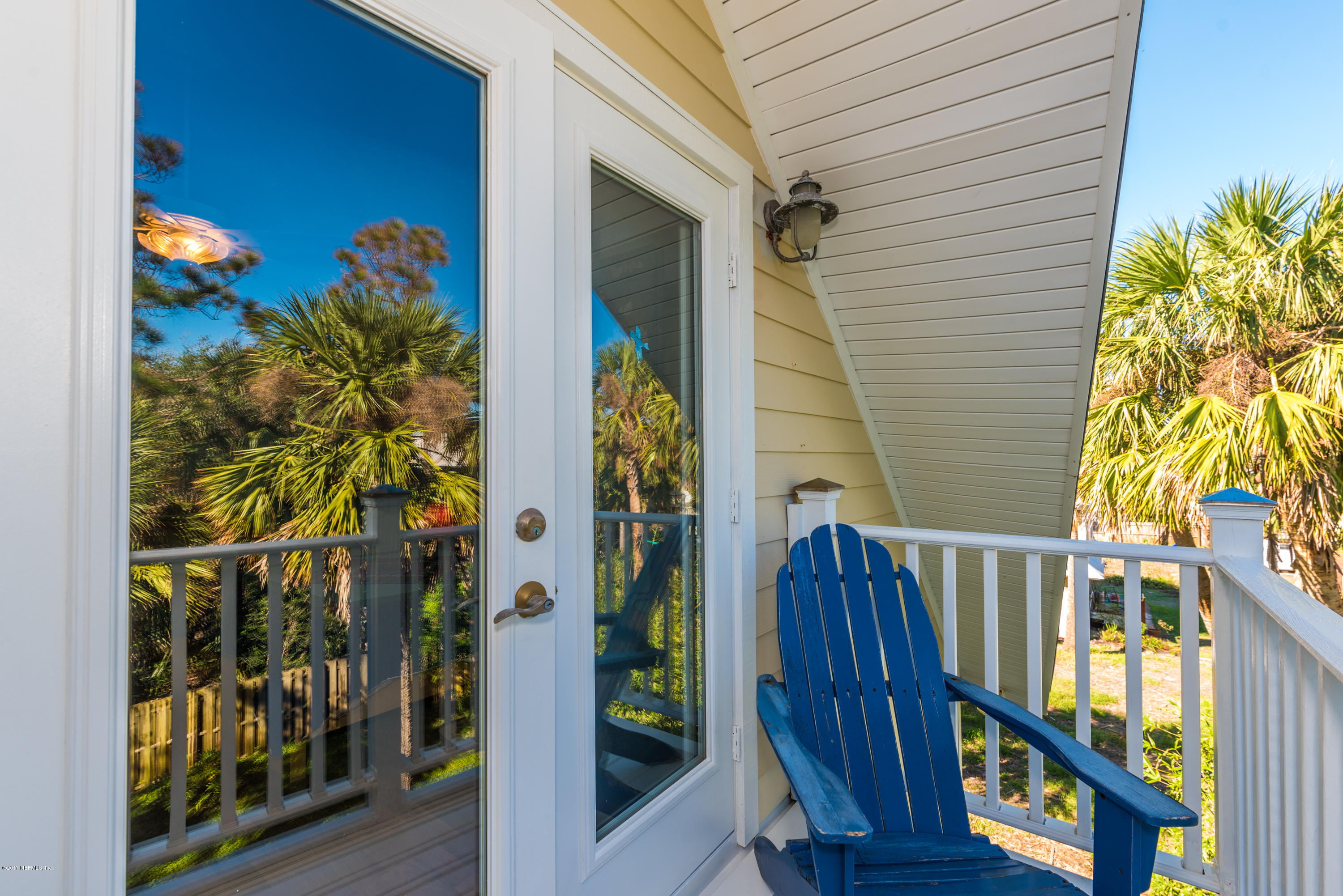 64 Manresa Road St. Augustine, FL 32084 - Photo 21 of 31 a view of a house with a small yard and wooden floor and fence