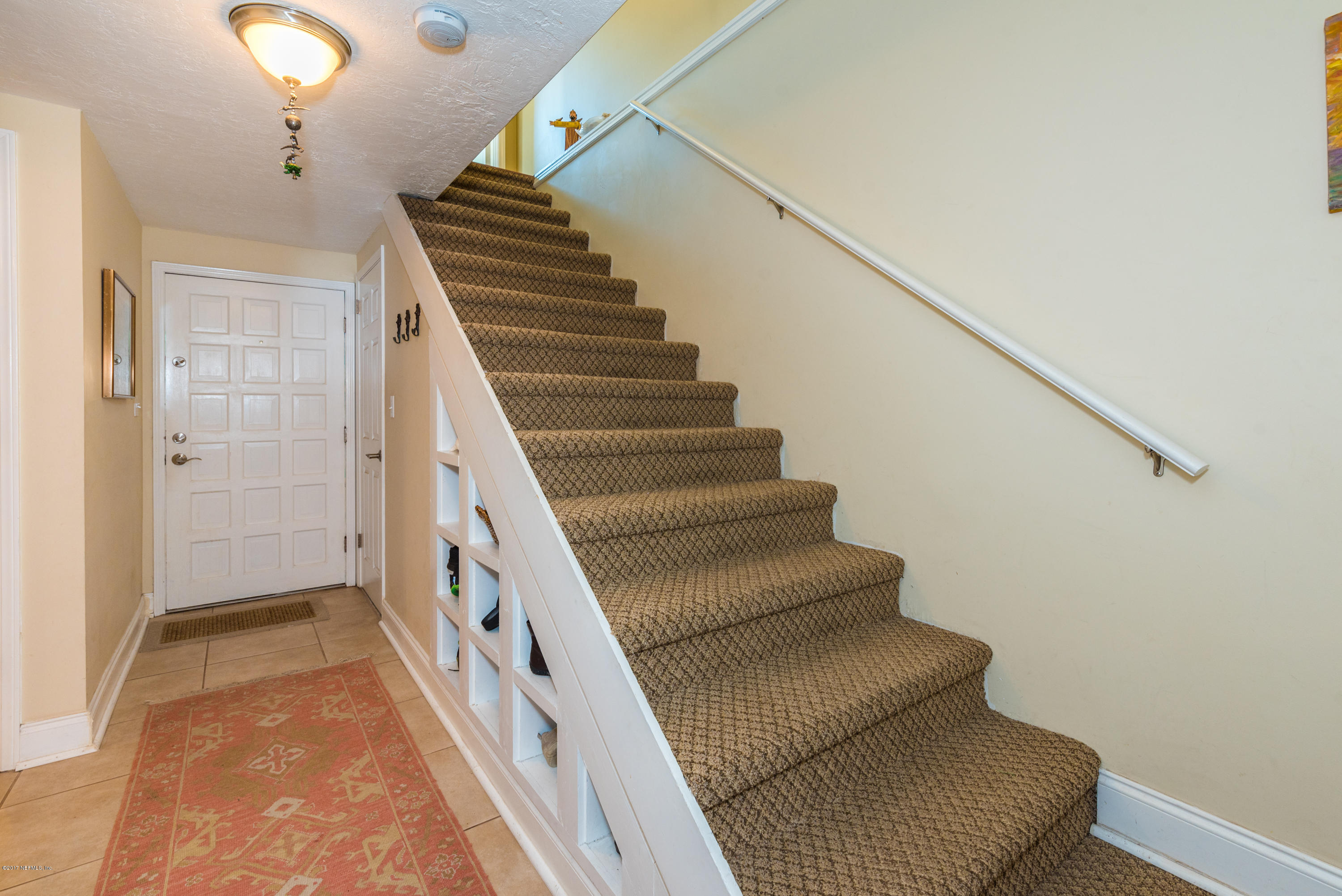 64 Manresa Road St. Augustine, FL 32084 - Photo 7 of 31 a view of entryway and hall with wooden floor