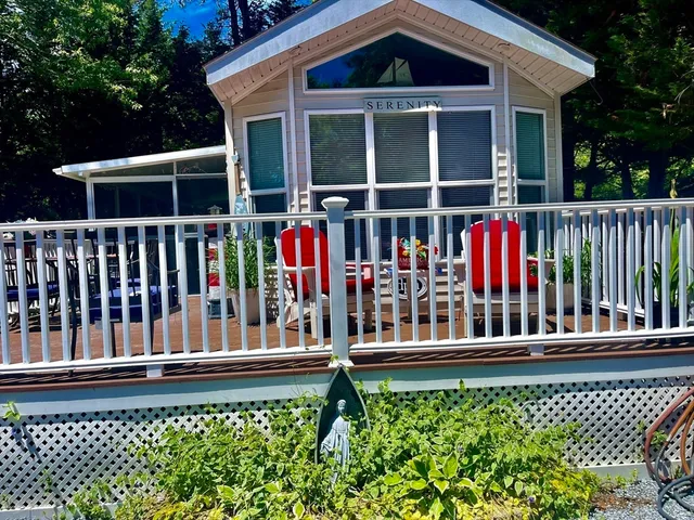 a view of a house with wooden fence