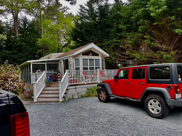 a front view of a house with parking space